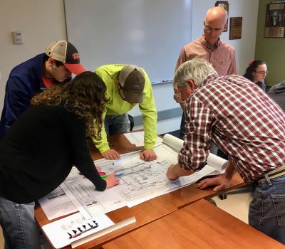 students looking at maps