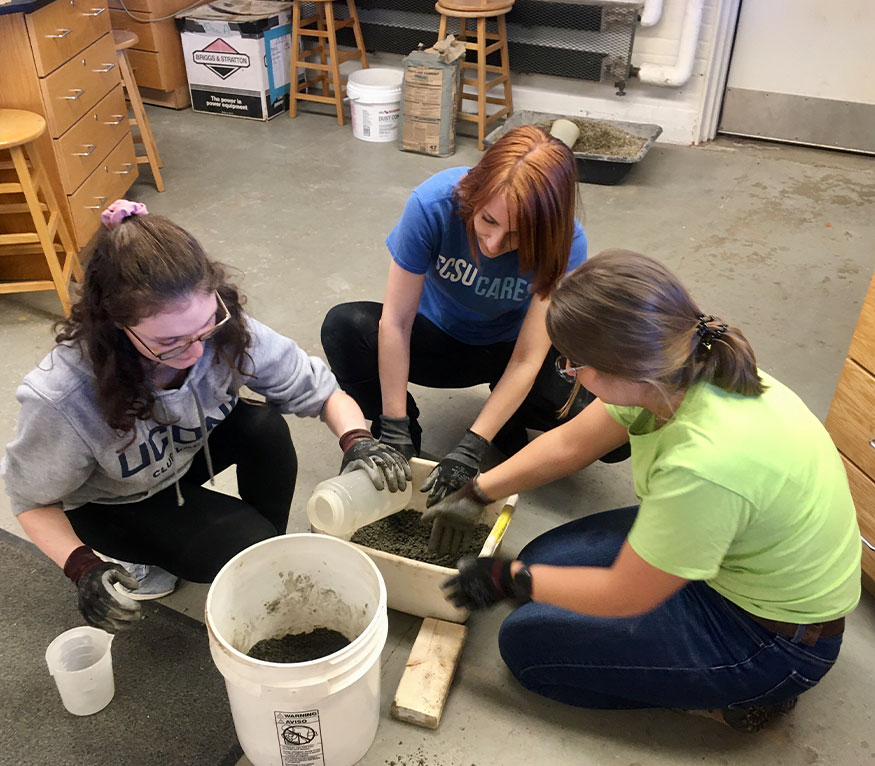 students mixing cement